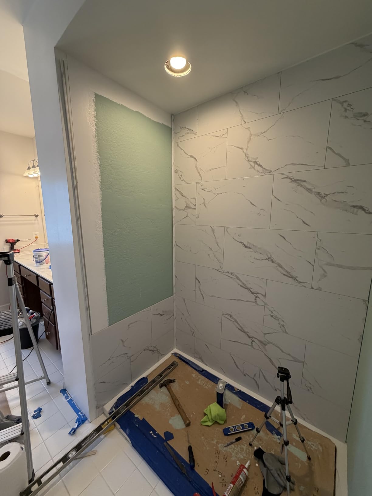 Palisade 25.6 in. x 14.8 in. Vinyl Wall Tiles in Carrara Marble (8 Pack) | Interlocking waterproof tiles for kitchen or bathroom customer photo 1
