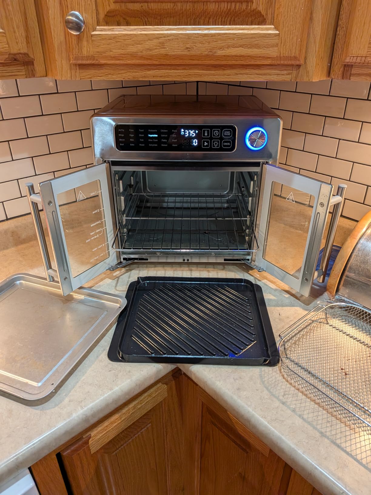 Emeril Lagasse 26QT French Door Multi-Function Air Fryer Toaster Oven | 26QT air fryer oven with French doors, 24 cooking functions, dual-speed fan and rotisserie for easy family meals. customer photo 1