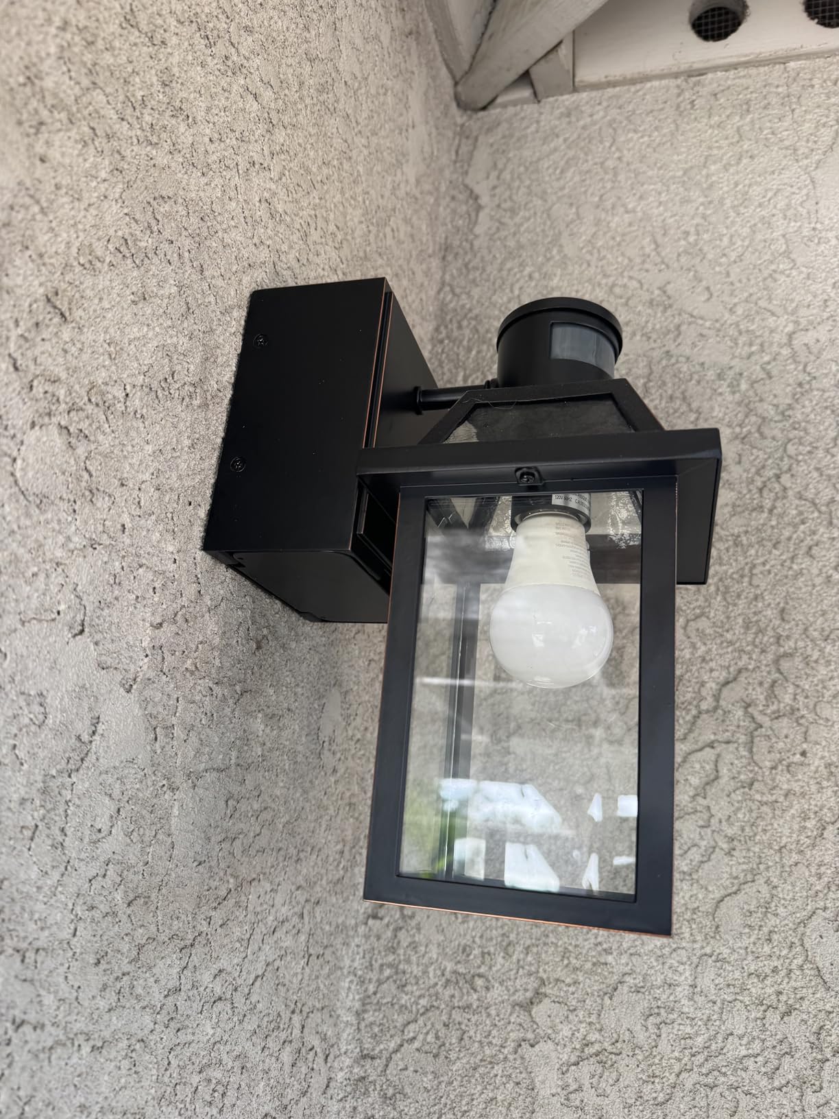 Yisuro Porch Lights with GFCI Outlet, Dusk to Dawn Motion Sensor Outdoor Light, 3 Lighting Modes Exterior Fixture, Outside for House Front Door Patio Garage (2 Pack Black) customer photo 1